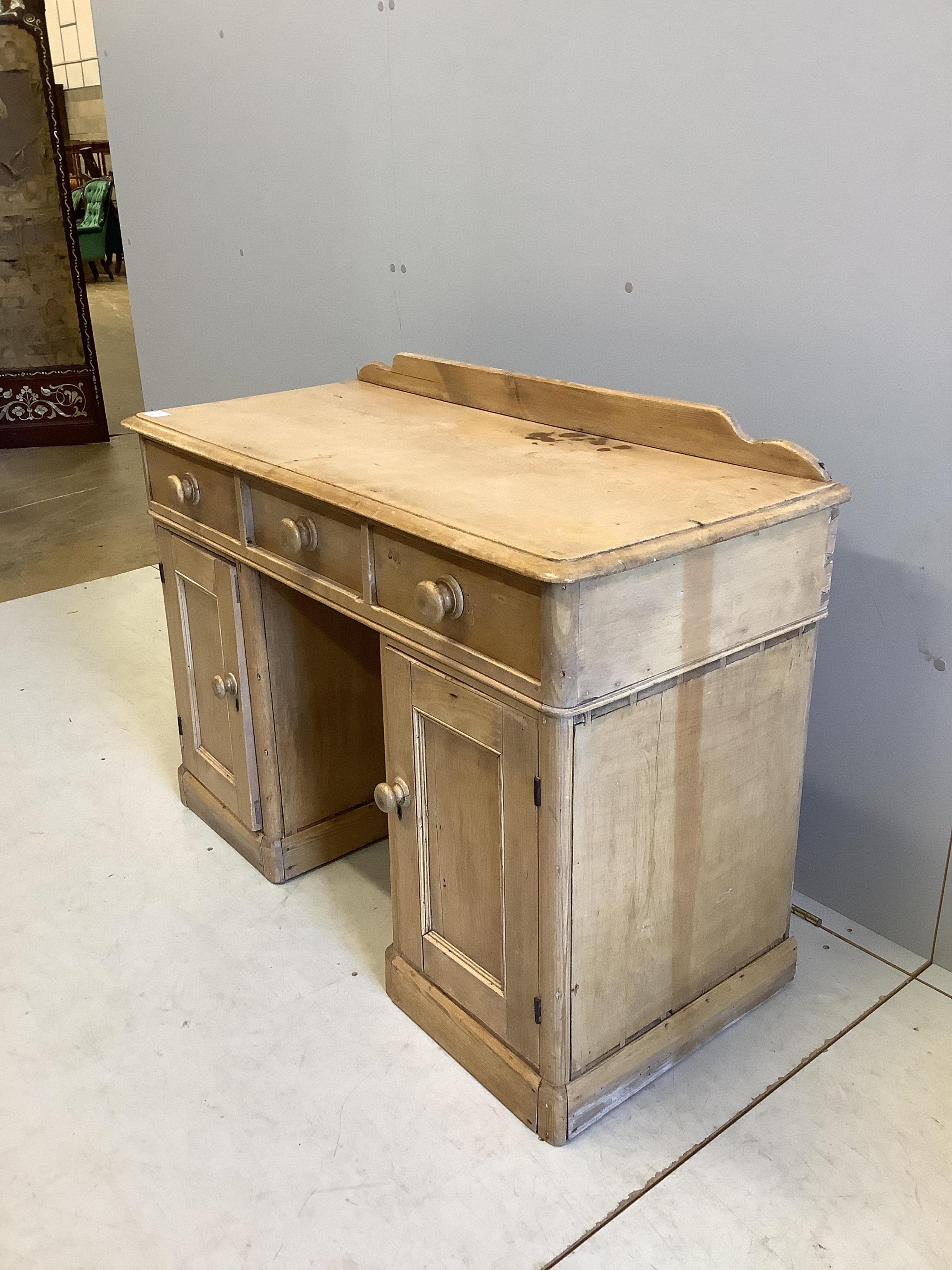 A Victorian pine kneehole dressing table, width 106cm, depth 46cm, height 80cm. Condition - fair